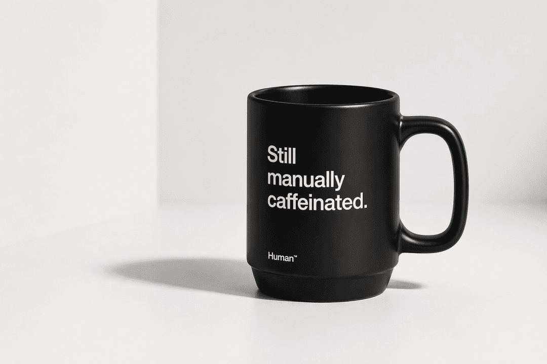 Human™ Mug — Still manually caffeinated.
